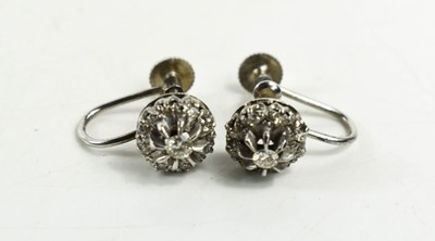 Lot 26 - A pair of 9ct gold and diamond flowerhead...