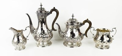 Lot 425 - A silver tea set, embossed with Rococo style...