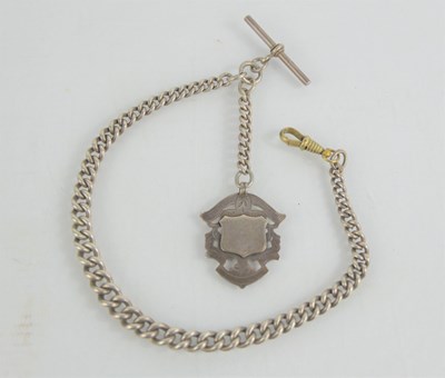 Lot 117 - A silver Albert chain with T- bar and fob....