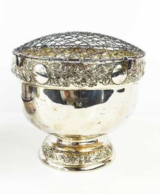 Lot 410 - A silver flower frog, with embossed borders,...