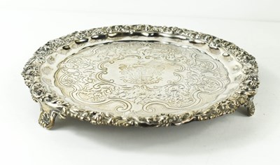 Lot 406 - A silver salver, with embossed foliate border,...