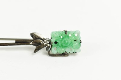 Lot 33 - A silver and jade brooch / pin, the...