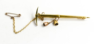 Lot 55 - A gold tie pin in the form of a pick axe, with...