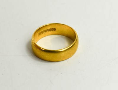 Lot 125 - A 22ct gold wedding band, size J/K, 6.13g.