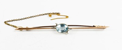 Lot 69 - A 9ct gold bar brooch set with an oval cut...