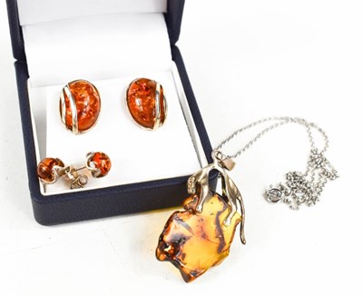 Lot 196 - A silver and amber pendant and chain, possibly...