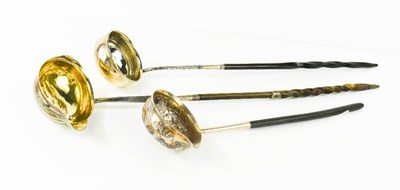 Lot 102 - Three 19th century horn and silver ladles, of...