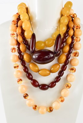 Lot 53A - A group of six vintage faux amber necklaces,...