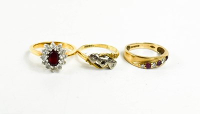 Lot 95 - An 18ct gold and diamond three stone ring, set...