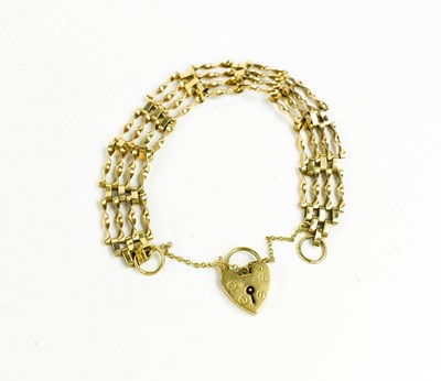 Lot 131 - A 9ct gold gate link bracelet, with heart...