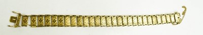 Lot 155 - A 9ct gold twenty eight panelled bracelet,...