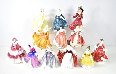 Lot 242 - A group of eleven Royal Doulton figurines and...