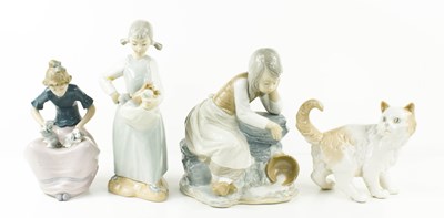 Lot 147 - Four Nao porcelain figures comprising girl...