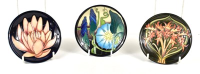 Lot 205 - A group of three Moorcroft pin dishes,...