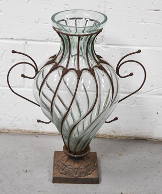 Lot 490 - A large glass and iron pedestal vase, of...