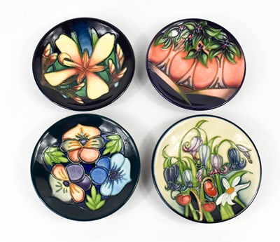 Lot 209 - A group of four Moorcroft pottery dishes, to...