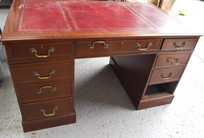 Lot 541 - A mahogany twin pedestal desk, with gilt...