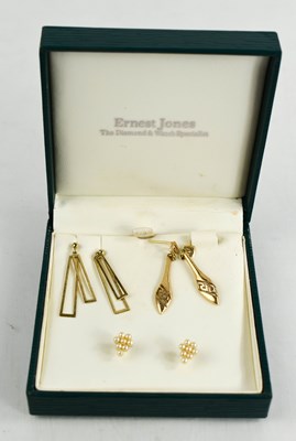 Lot 244 - Three pairs of 9ct gold earrings, one pair set...