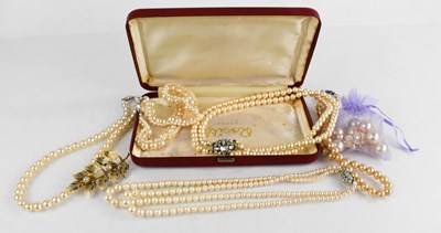 Lot 216 - A group of simulated pearl necklaces; one with...