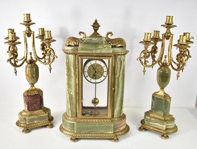 Lot 476 - A German clock garniture in the neo-classical...