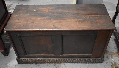 Lot 522 - A 17th century oak coffer, with plank top and...