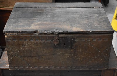 Lot 523 - An 18th century oak chest with iron lock plate...