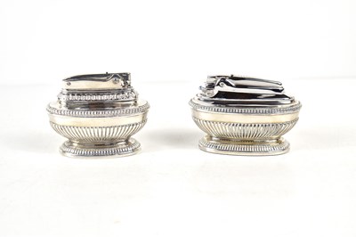 Lot 47 - A pair of vintage silver plated table lighters...