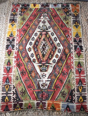 Lot 501 - A 19th century Turkish Kilim rug in red, blue,...