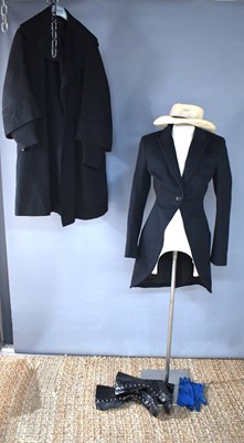 Lot 76 - A gentleman's mourning coat, in black wool,...