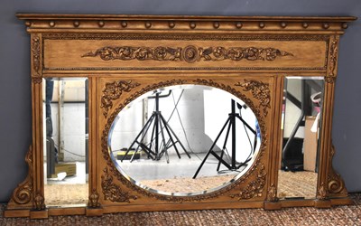 Lot 474 - An ornately Classical style overmantle mirror,...