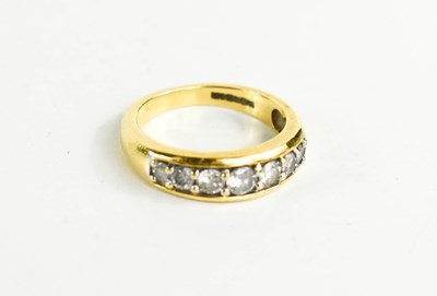 Lot 193 - An 18ct gold and diamond seven stone ring, the...