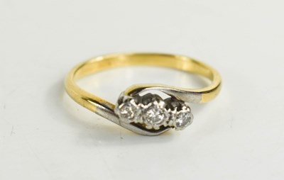 Lot 119 - A diamond three stone ring illusion set ring,...