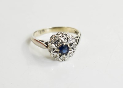 Lot 173 - An 18ct white gold, diamond and sapphire...