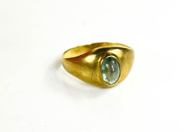 Lot 62 - A 9ct gold ring set with a green cabochon in...