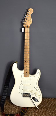 Lot 375 - A Fender Stratocaster electric guitar in ivory...