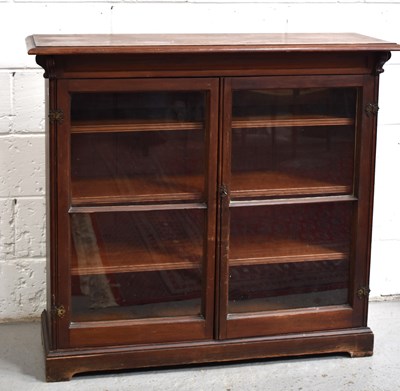 Lot 509 - An Edwardian stained pine glazed cabinet with...