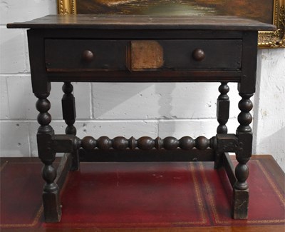 Lot 540 - A 17th century oak side table with single...