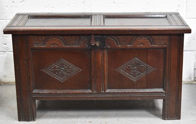 Lot 548 - A 17th century oak coffer with two panel lid...