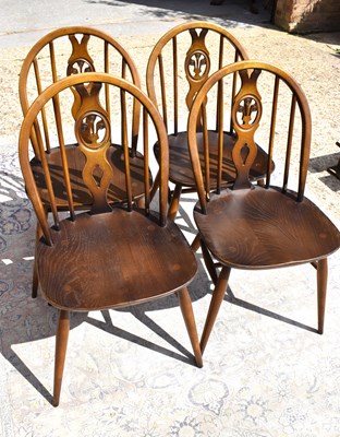 Lot 513 - Four Ercol dining chairs with pierced back...