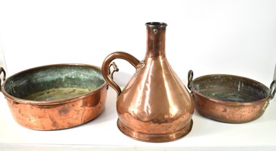 Lot 466 - Two large antique copper pans together with a...