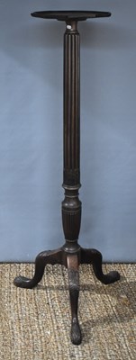 Lot 536 - A mahogany jardiniere stand with fluted column...