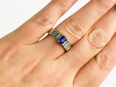 Lot 26 - A white gold, sapphire and diamond ring, the...