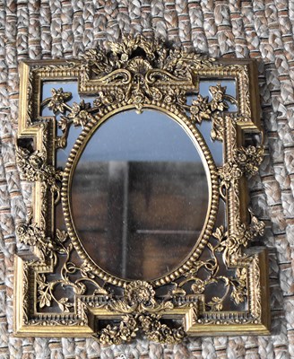 Lot 469 - A giltwood style wall mirror, with central...