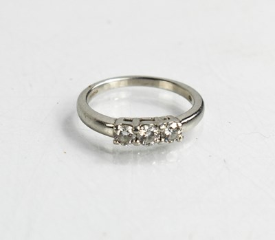 Lot 82 - A platinum and diamond three stone ring, the...