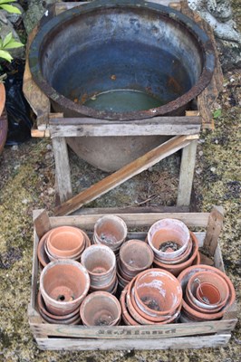 Lot 489 - A cast iron bell shaped pot, together with a...