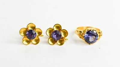 Lot 192 - A 22ct gold and deep purple sapphire ring,...