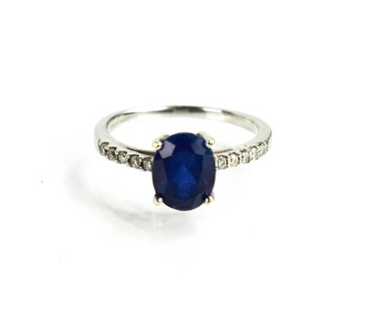 Lot 17 - A 9ct white gold, sapphire and diamond ring,...