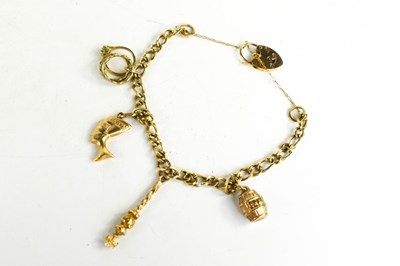 Lot 182 - A 9ct gold open curb link charm bracelet, with...