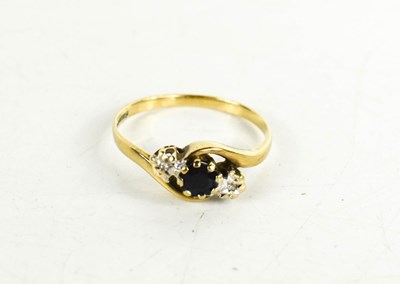 Lot 58 - A 9ct gold, sapphire and diamond crossover...