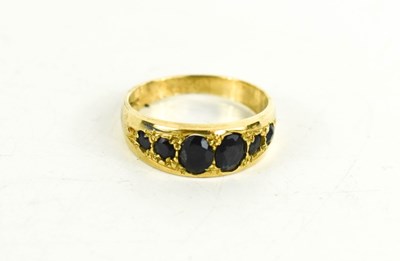 Lot 92 - A 9ct gold and sapphire six stone ring, size O,...